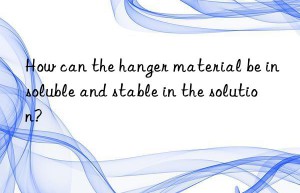 How can the hanger material be insoluble and stable in the solution?